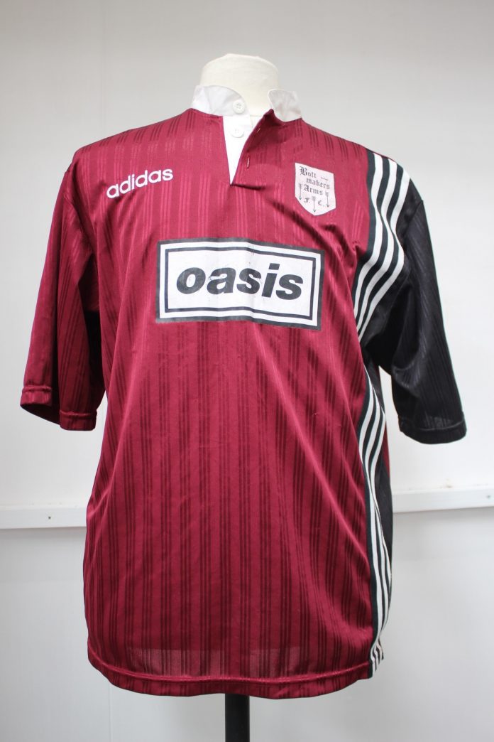 Oasis' "battered" tambourine and bespoke football shirts to be auctioned off
