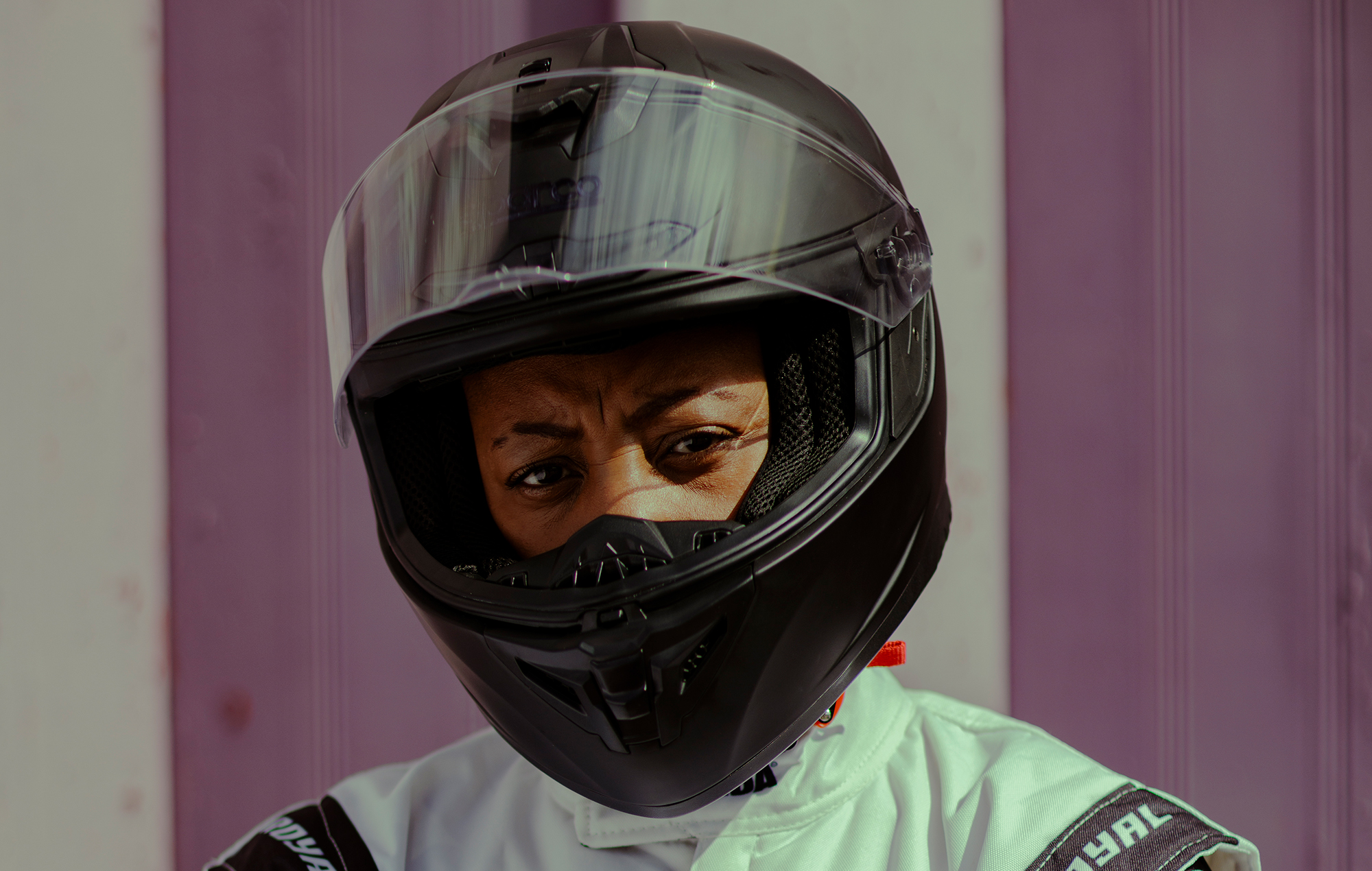 OneDa in a Formula One racing helmet and suit, photo by Jody Hartley